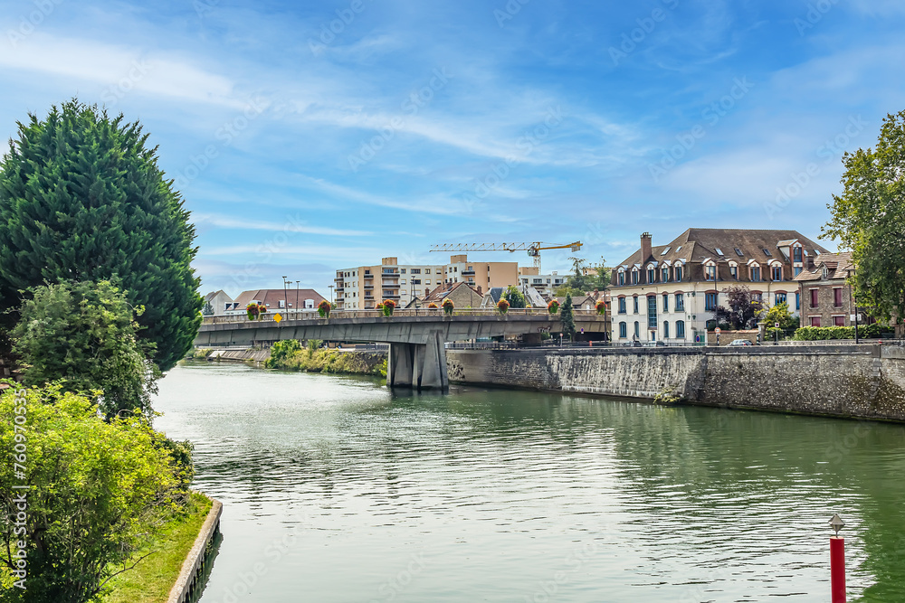 Beautiful view of the banks of the Seine River in the city of. Melun, Seine-et-Marne department, France. 