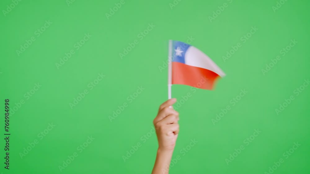 Hand waving a pennant of a chilean national flag
