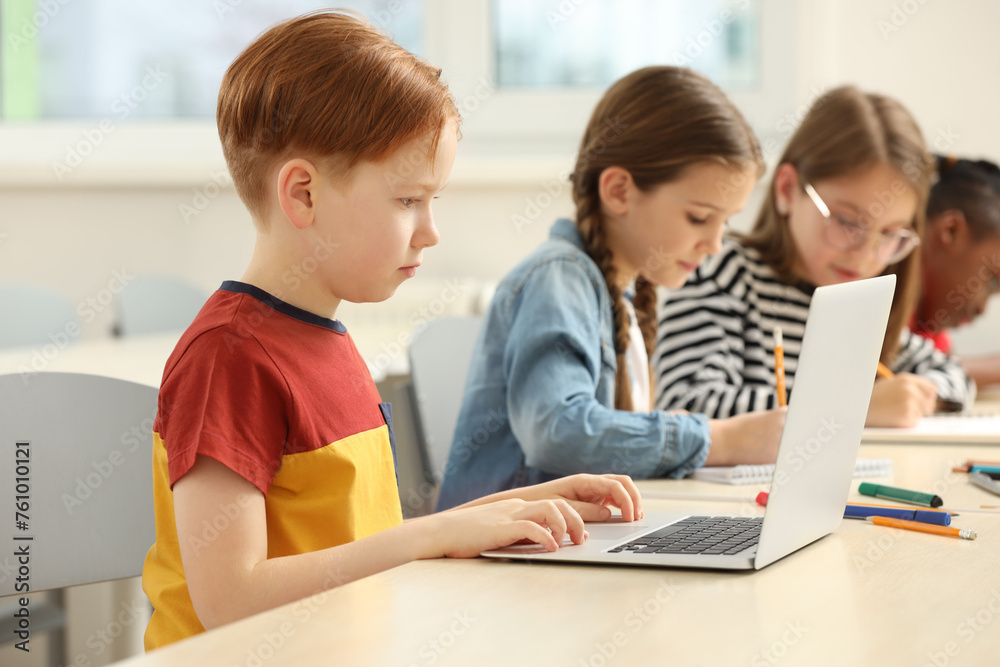 Cute children studying in classroom at school Cute children studying in classroom at school