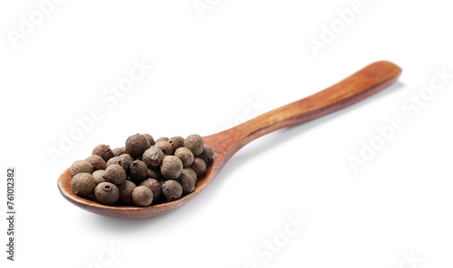 Dry allspice berries (Jamaica pepper) in spoon isolated on white