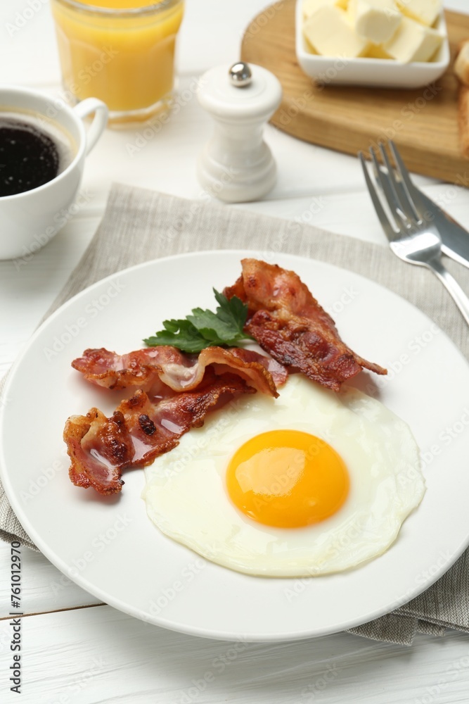 Delicious breakfast with sunny side up egg served on white wooden table Delicious breakfast with sunny side up egg served on white wooden table