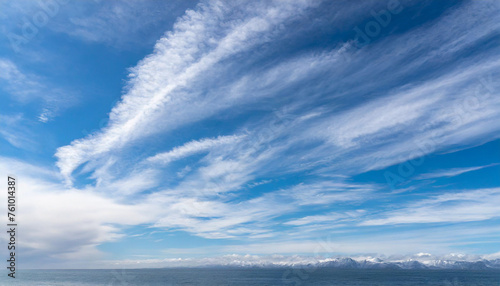 Beautiful blue sky with white wispy clouds, a perfect replacement background for photos