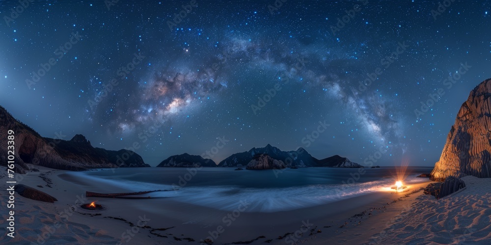 Nighttime Camping by the Beach Under a Starry Sky with Milky Way Arching Over Mountains