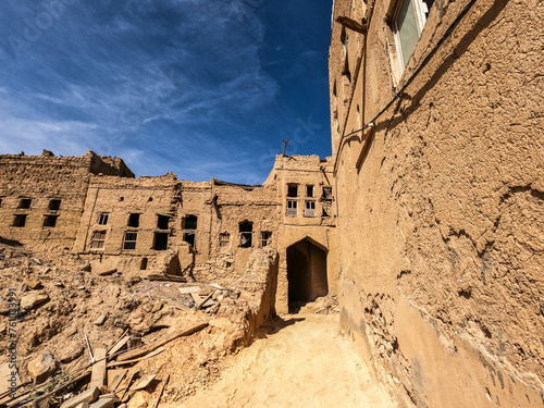 Falling down mud-brick ruins of the old village in Al Hamra, Oman photo