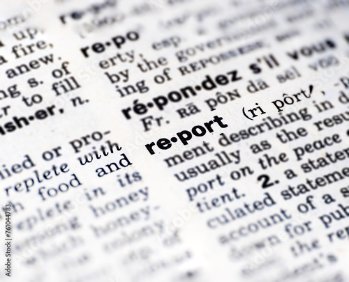 Closeup of the word report in the dictionary