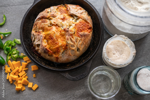 Jalapeno and cheese sourdough bread in a cast iron dutch oven