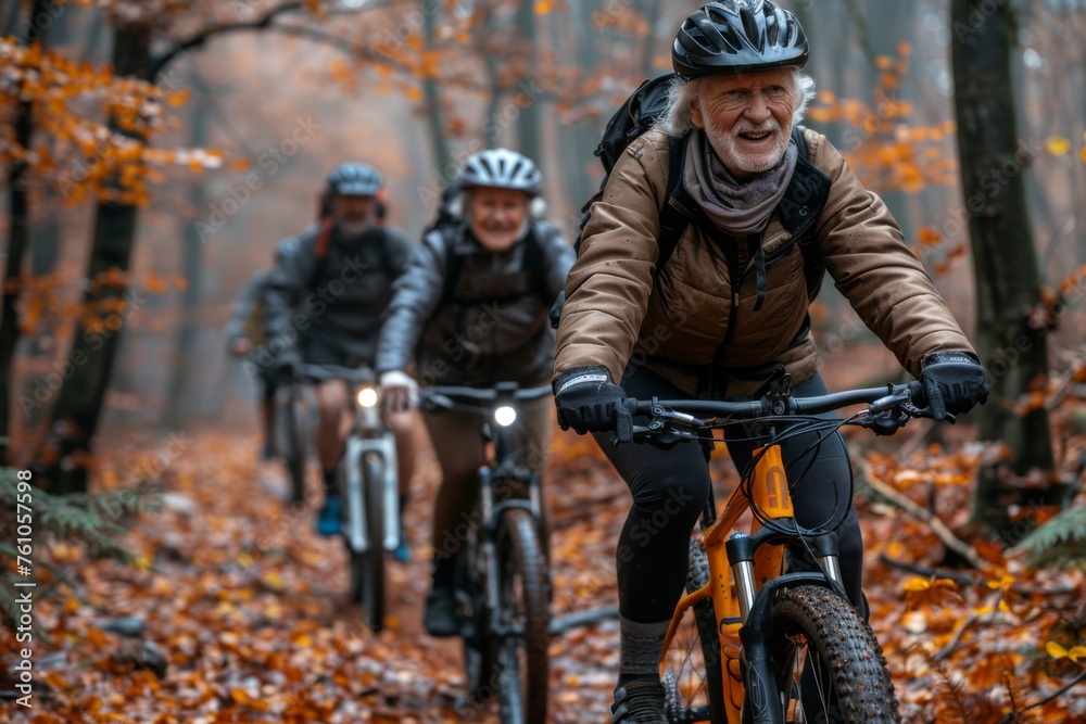 Senior cyclists enjoying a ride through autumn woods.
