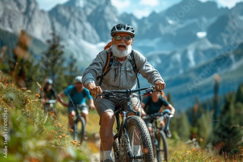 Senior cyclist leads the way on a mountain trail. © Good AI