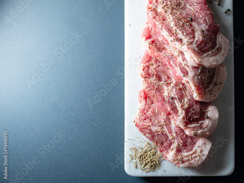 Raw pork and spices on a plate photo