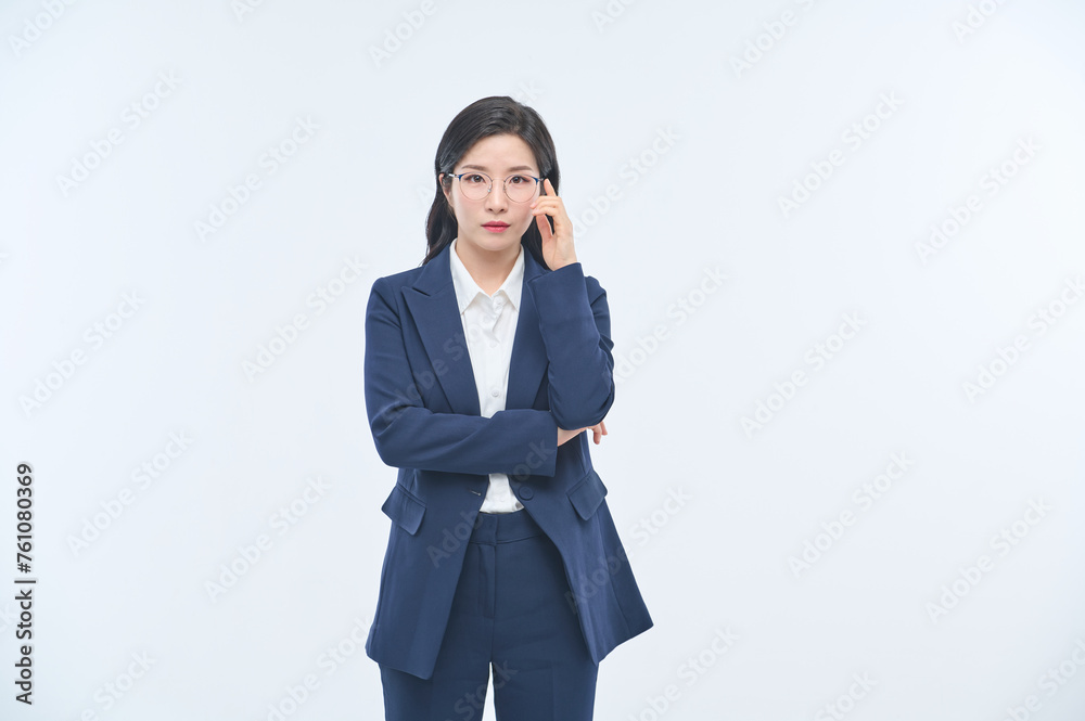 A young businesswoman in a suit is making various facial expressions and gestures. A young businesswoman in a suit is making various facial expressions and gestures.