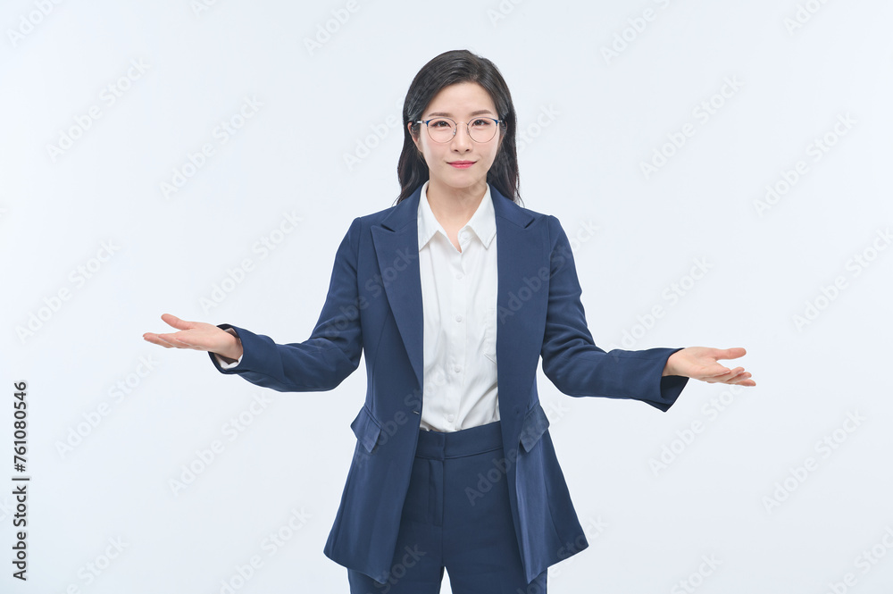 A young businesswoman in a suit is making various facial expressions and gestures. A young businesswoman in a suit is making various facial expressions and gestures.