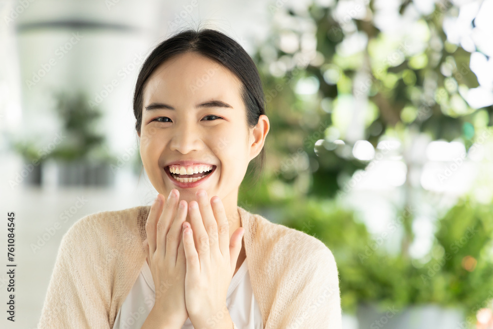 Happy, laughing, excited asian woman in casual dress, healthy city with green tree environment. Happy, laughing, excited asian woman in casual dress, healthy city with green tree environment.