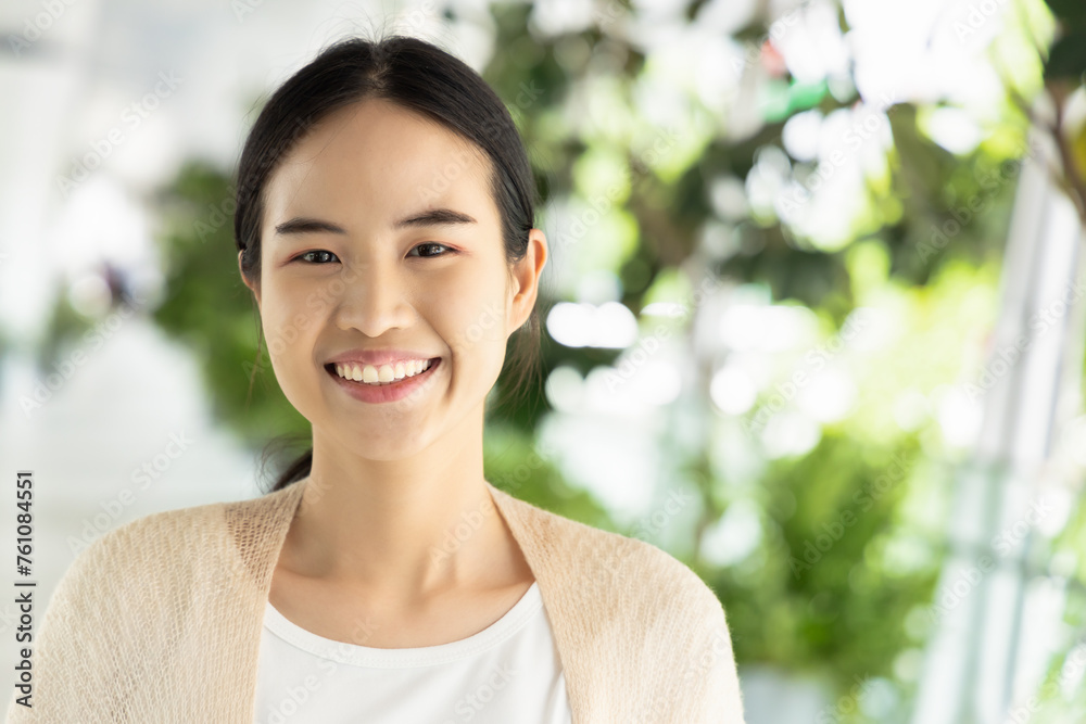 Happy, smiling, friendly asian woman in casual dress, showing positive facial expression. Happy, smiling, friendly asian woman in casual dress, showing positive facial expression.