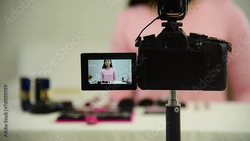 Beauty blogger video production for female fashion blog online cosmetic adviser record woman lifestyle tutorial. Trendy female vlogger showing how to use cosmetics products live via social media.