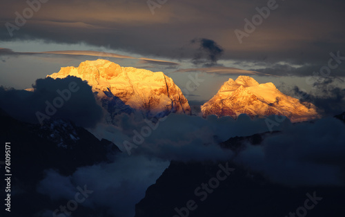 Snow covered Himalayan mountain peaks during colorful sunset in Annapurna Conservation Area
