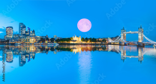 Panorama of the Tower Bridge and Tower of London on Thames river at twilight blue hour - London, England