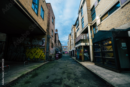 Fototapeta Naklejka Na Ścianę i Meble -  Dark Ghetto street with grafitis in london
