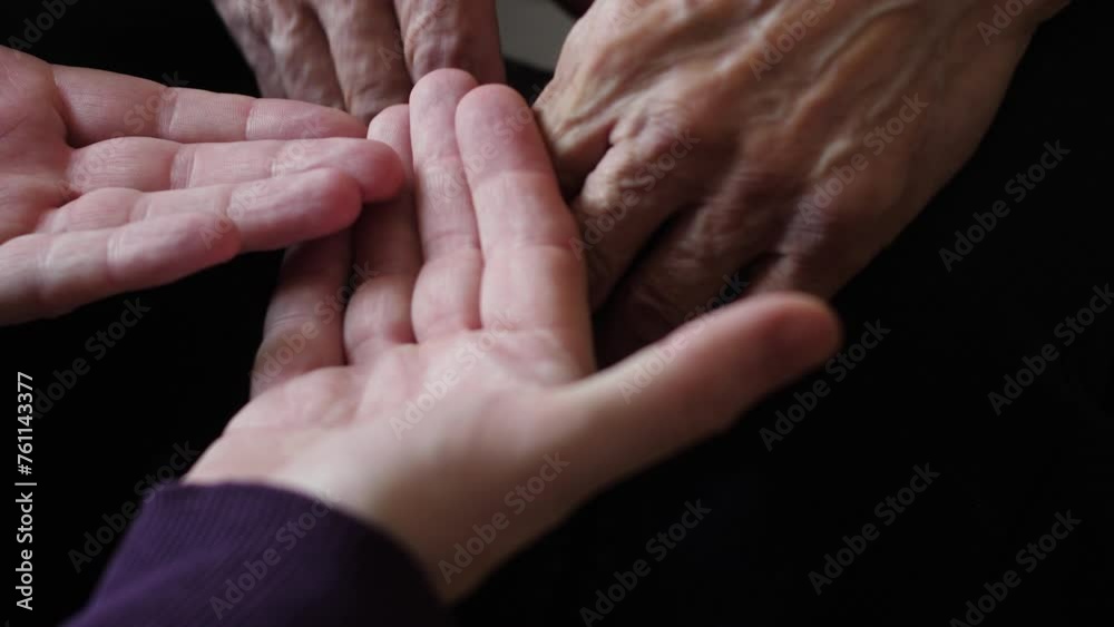 Caring care, Son helps elderly father. adult son holds hands of elderly father. family care. emotions of men Caring care, Son helps elderly father. adult son holds hands of elderly father. family care. emotions of men