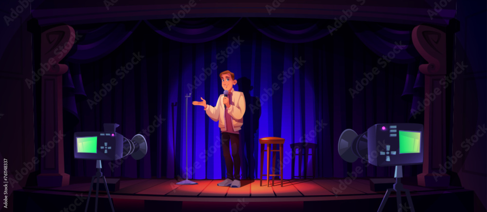 Man standup comedy performer on stage with mic and stool, blue curtain and tv cameras, lighted with spotlight. Comedian male artist during entertainment on scene. Talent show or theater presentation.