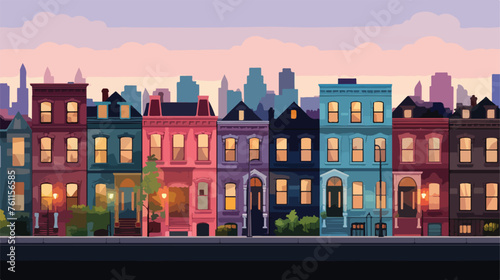 A row of brownstone rowhouses at twilight 