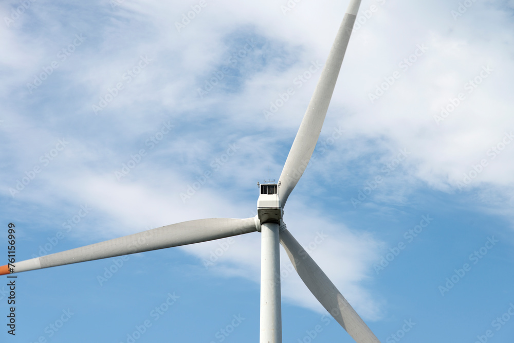 View of the wind turbine on the hill against the sky background View of the wind turbine on the hill against the sky background