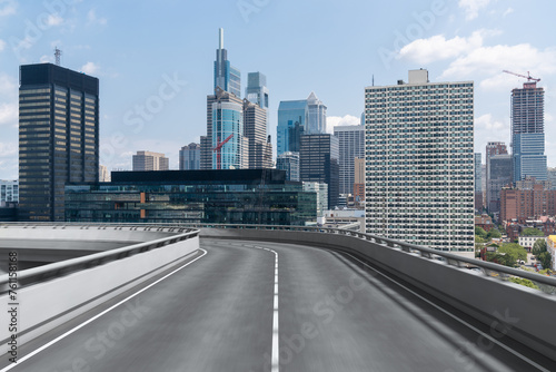 Empty urban asphalt road exterior with city buildings background. New modern highway concrete construction. Concept way to success. Transportation logistic industry fast delivery. Philadelphia. USA. © VideoFlow