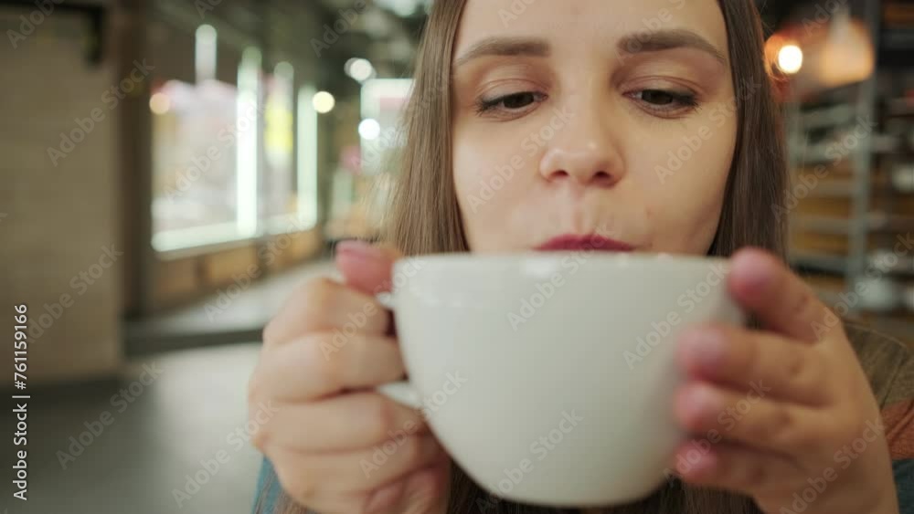 Serene Morning Moment as a Young Woman Sips Coffee in a Cozy Urban coffee shop Serene Morning Moment as a Young Woman Sips Coffee in a Cozy Urban coffee shop