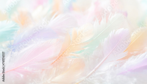 Background image of a large number of feathers in pastel rainbow colors