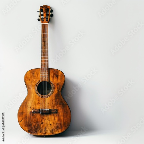 Wooden guitar on a white background.