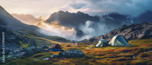 Wild camping in the mountains. Dawn landscape with background