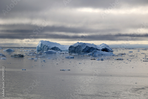 Arctic, Greenland-Icebergs in Disko Bay a large bay on the western coast of Greenland-The bay constitutes a wide southeastern inlet of Baffin Bay photo