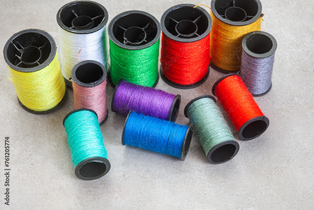 collection of colorful sewing thread on grey, with copy space
collection of colorful sewing thread on grey, with copy space