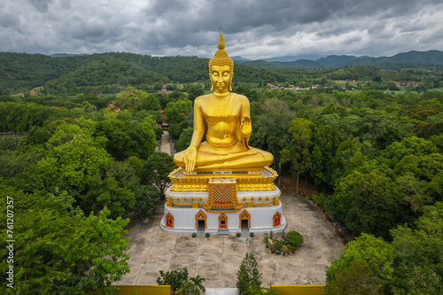Big Gold Buddha statue at Wat Pha Thang, Uthai Thani, Thailand