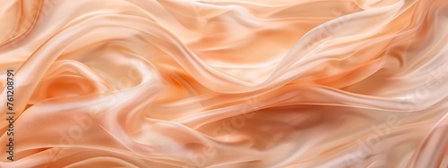 delicate peach-colored silk fabric is caught by a gust of wind, swaying and swaying with rapid movement. The fabric creates a dynamic and flowing abstract pattern against a simple background