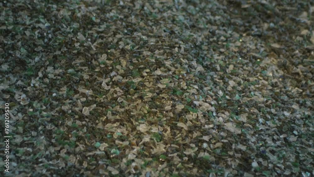 Mountain of recycled glass fragments at a factory that recycles glass from cans, bottles and windows