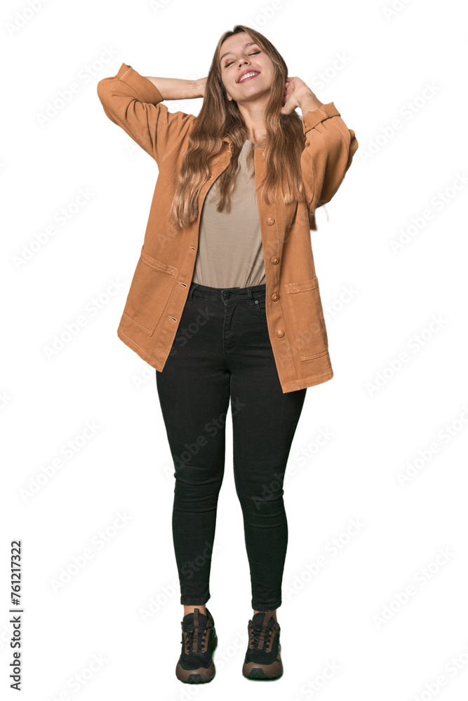 Studio portrait of a blonde Caucasian woman feeling confident, with hands behind the head. Studio portrait of a blonde Caucasian woman feeling confident, with hands behind the head.