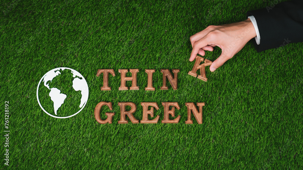 Hand arrange wooden alphabet in ecological awareness campaign with ECO icon design on biophilia green grass background to promote environmental protection for greener and sustainable future. Gyre - obrazy, fototapety, plakaty 