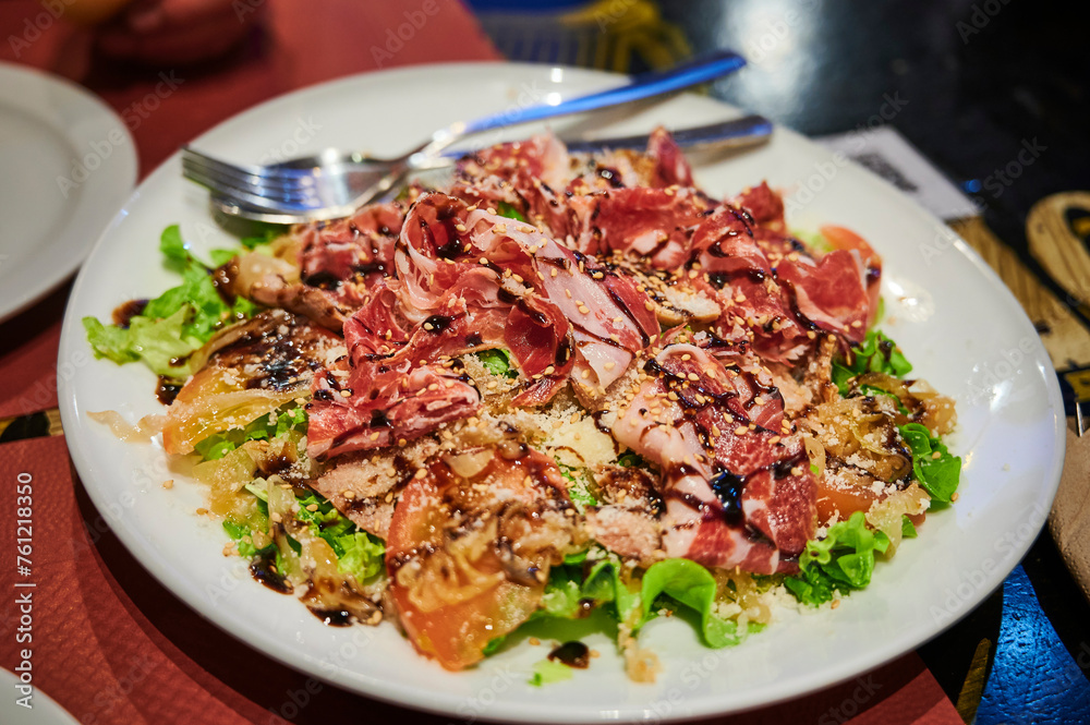 Healthy salad with lettuce, tomato ham and sesame seeds Healthy salad with lettuce, tomato ham and sesame seeds