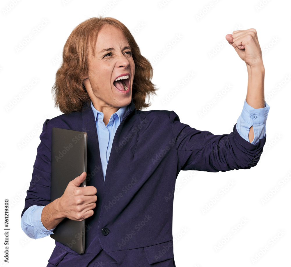 Mid-aged Caucasian with laptop in studio raising fist after a victory, winner concept. Mid-aged Caucasian with laptop in studio raising fist after a victory, winner concept.