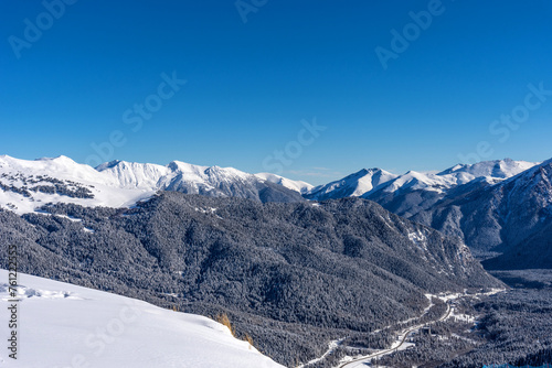 Beautiful landscape of the Arkhyz ski resort with mountains  snow  forest on sunny winter day. Caucasus Mountains  Russia.