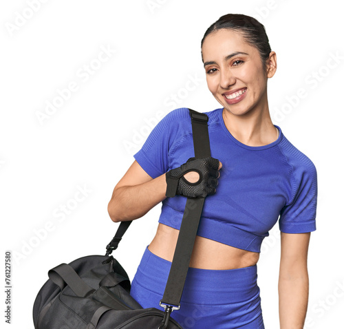 Young Caucasian athlete with gym bag photo