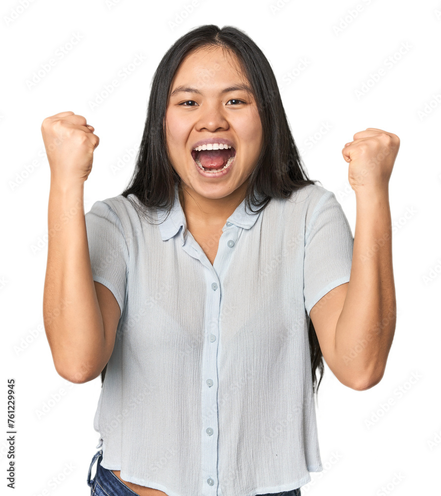 Young chinese woman isolated cheering carefree and excited. Victory concept.