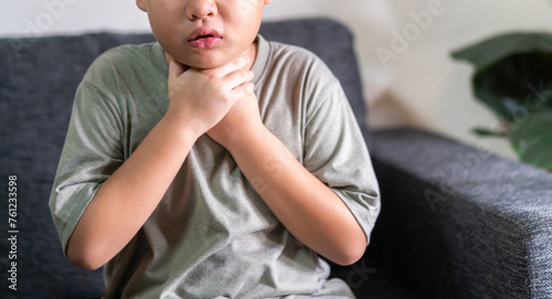 Quadro su tela Sick asian boy touching neck unwell coughing with sore throat pain,lung cancer,bronchitis,Bronchial Asthma,Tuberculosis,pneumonia,covid-19,eco air pollution pm2