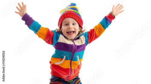 A little girl with a bright colorful jacket and hat explores the world with curiosity and joy