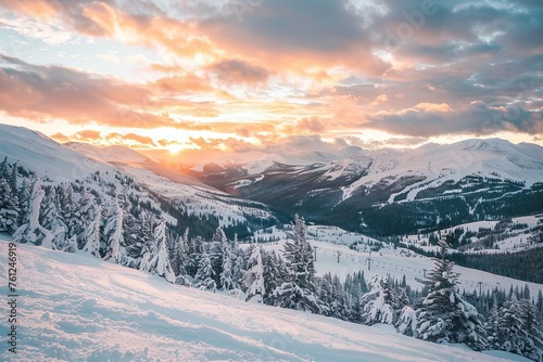 Snow-covered mountain landscape with a glowing sunset. photo
