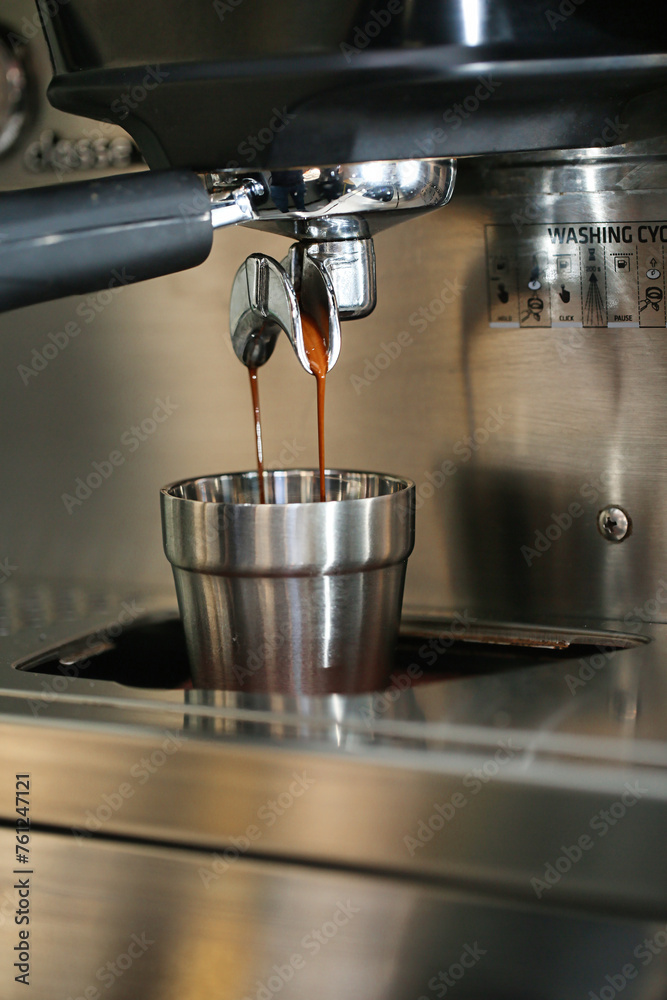 Espresso Machine Pouring Coffee Into a Cup