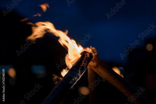 Close-up of campfire burning at night photo