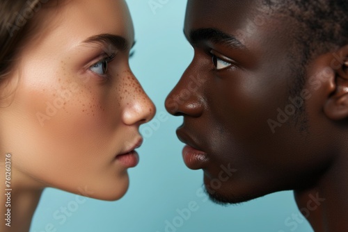 Interracial relationship, close-up of the faces of an African American man and a Caucasian woman looking at each other