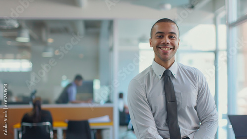 Wallpaper Mural Smiling professional man in business attire against an office backdrop radiating confidence. Torontodigital.ca