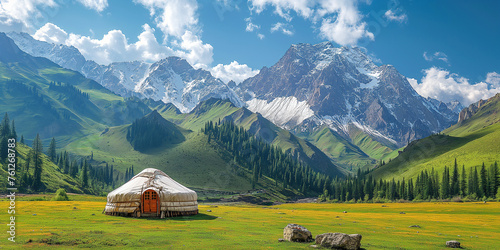 traditional Asian nomadic yurt in a field in the highlands against background of mountains in summer photo